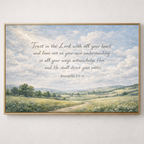 Framed artwork with a landscape scene and Proverbs 3:5-6 text on a white wall.
