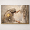 Framed artwork of a woman receiving a hand from an unseen figure with a gold frame.
