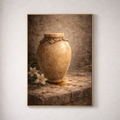 Framed artwork of a stone urn on a stone surface with flowers, against a textured wall.