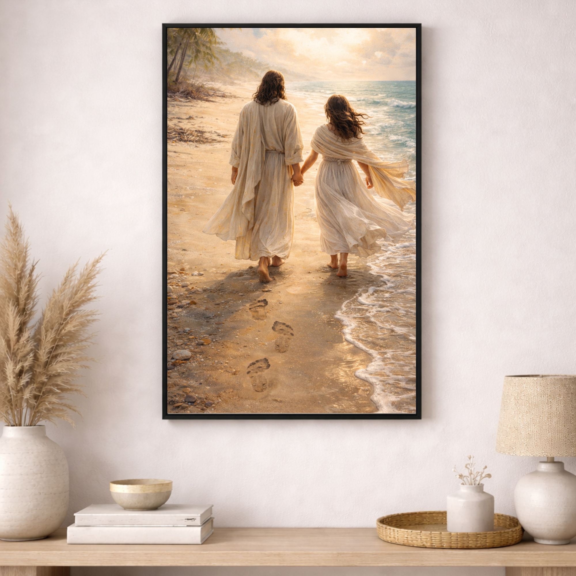 Framed artwork of two people walking on a beach with a lamp and decor items below.