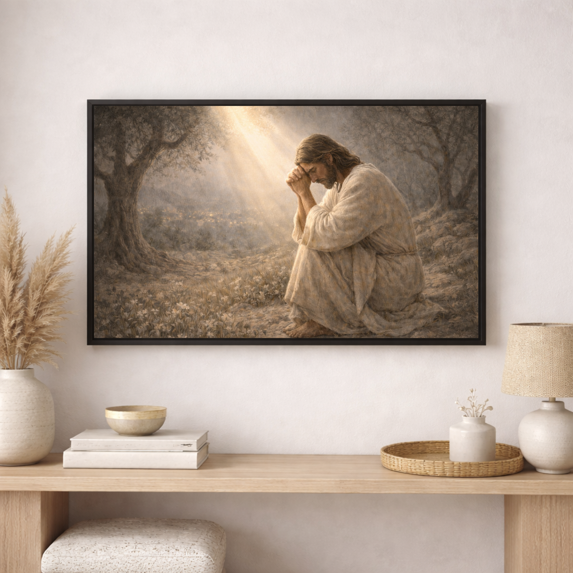 Framed artwork of a religious scene on a wall above a wooden console table.