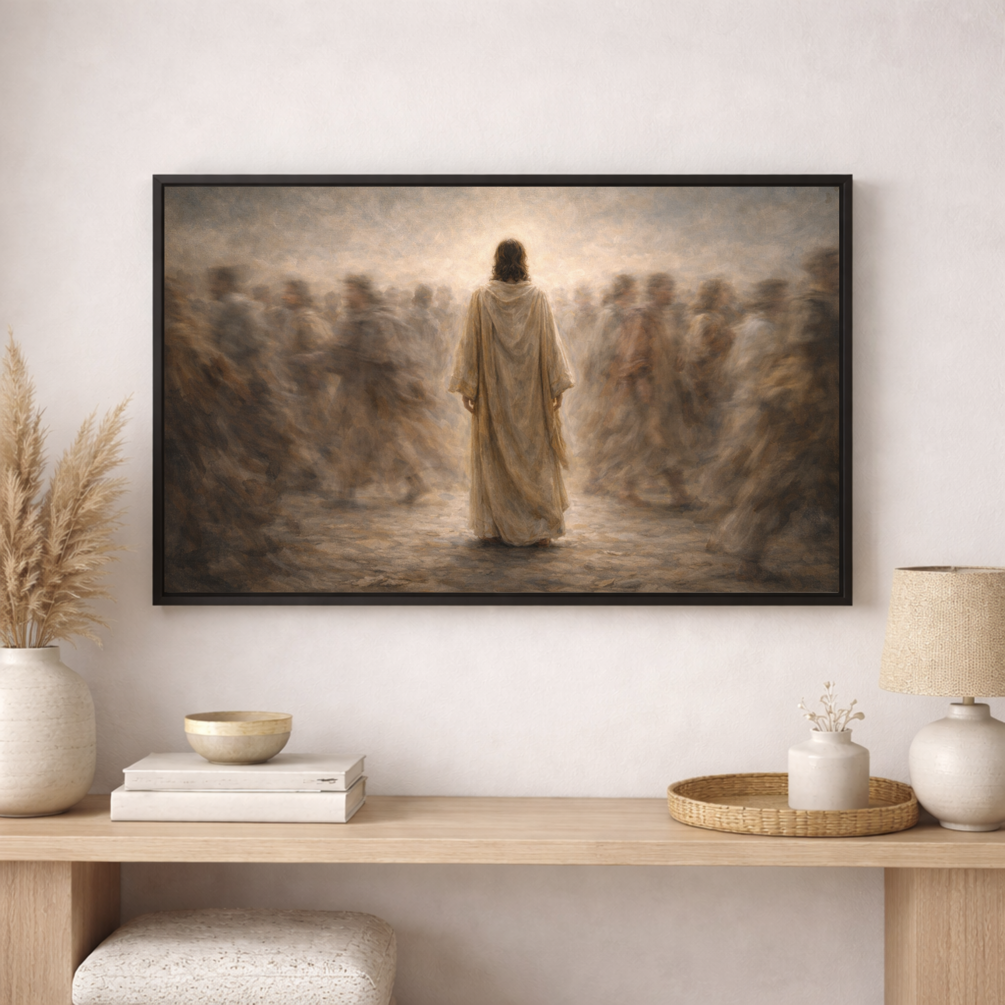 Framed artwork of a religious scene on a wall above a wooden console table with decorative items.