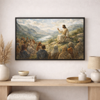 Framed artwork of a religious scene with a mountainous landscape, displayed on a wall above a wooden console table.