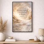 Framed abstract artwork with text on a wall above a wooden console table.