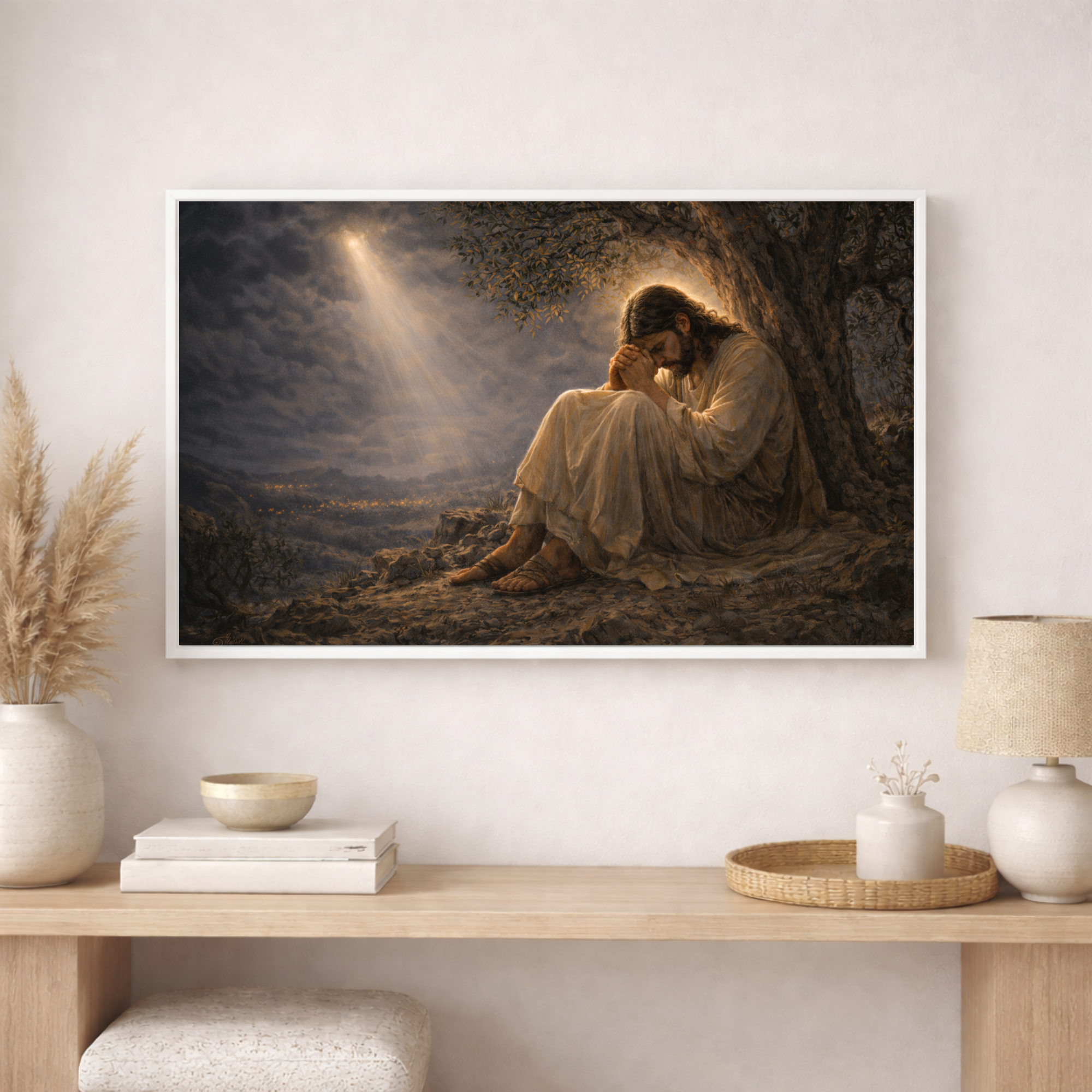 Framed artwork of a religious scene on a wall above a wooden shelf with decor items.