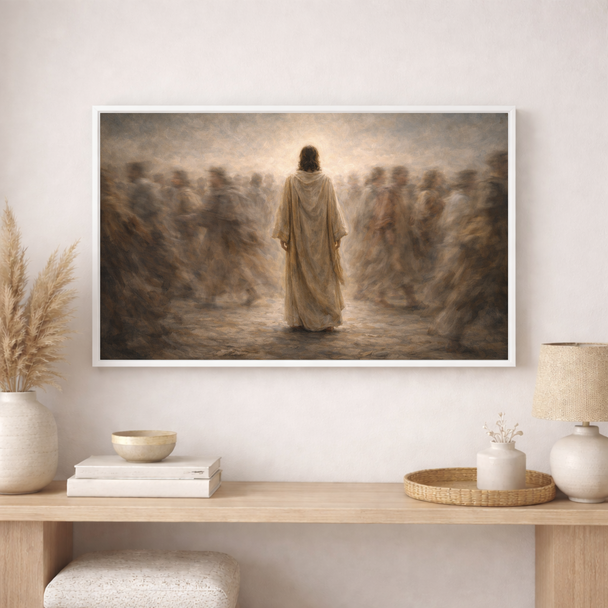 Framed artwork of a religious scene on a wall above a wooden console table with decorative items.