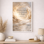 Framed abstract artwork with motivational quote on a wall above a wooden shelf.
