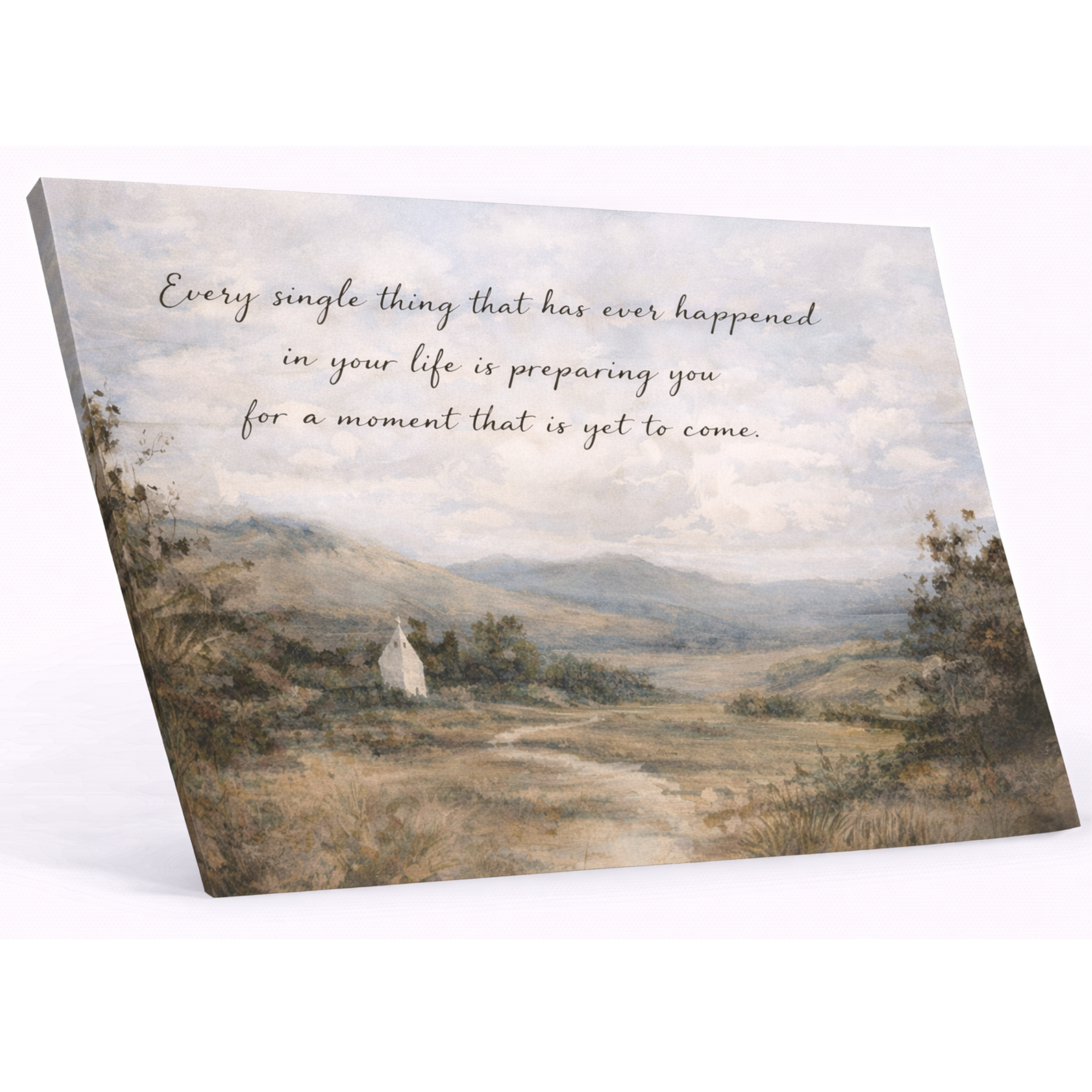 Canvas print with a scenic landscape and motivational quote on a white background