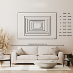 Living room with a white sofa, coffee table, and decorative elements, featuring a wall art with size chart.